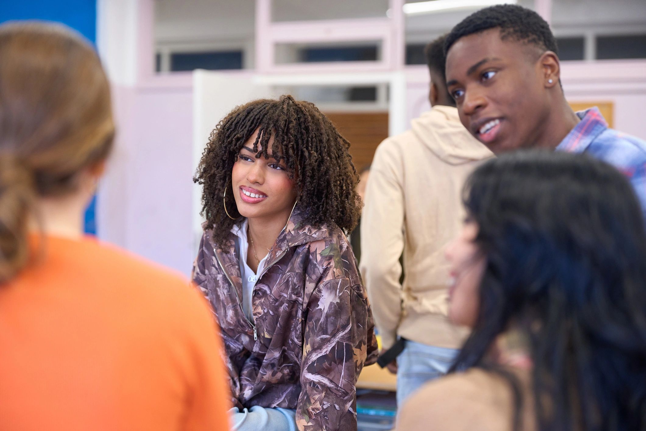 Students participating in a university classroom discussion